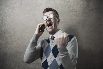 Angry guy yelling at phone