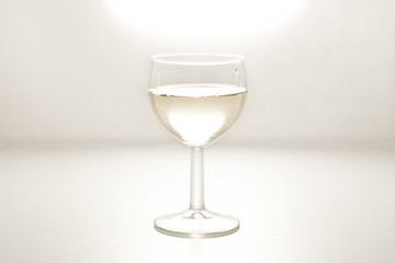 wine in a glass on white background
