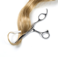 Long blond hair and scissors