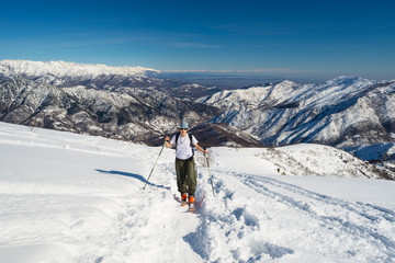 Fototapeta na wymiar Alpine touring towards the summit