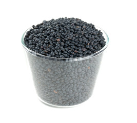 Fototapeta na wymiar black lentils in a bowl isolated on white