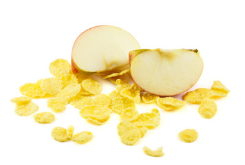 Apple slices and cornflakes on white background
