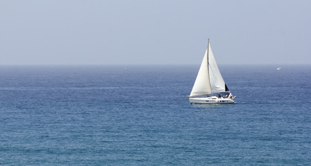 boat with white sails