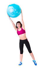 Young smiling woman makes exercise with fitball