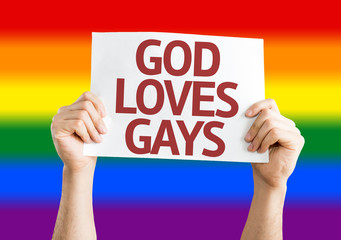 God Loves Gay card with Rainbow flag background