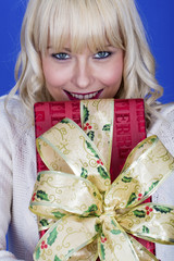 Attractive Young Woman Carrying Christmas Presents