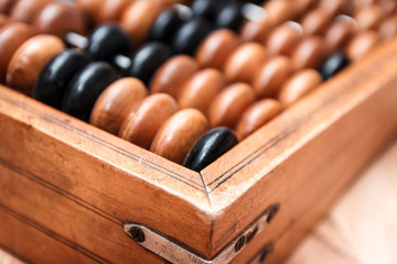 Old vintage abacus on a wooden table