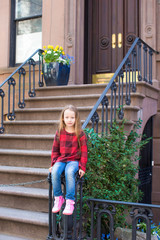 Obraz na płótnie Canvas Little girl in historic district of West Village
