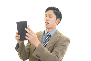 がっかりした表情のビジネスマン