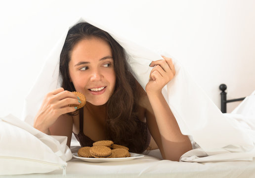  Woman Eating Sweet Chocolate Chip Cookies