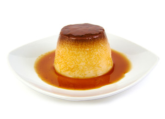 Creme caramel, caramel custard or custard pudding on white