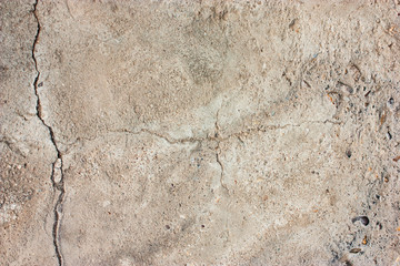 Cement floors are old and dirty.