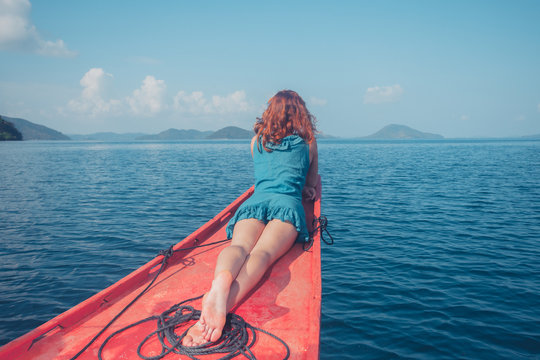 Woman on the bow of small boat