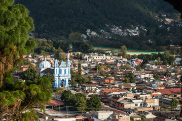 Fototapeta premium Aerial View of San Cristobal church and town at Chiapas, Mexico.