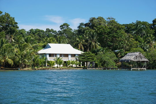 Oceanfront house and hut over the water in Panama