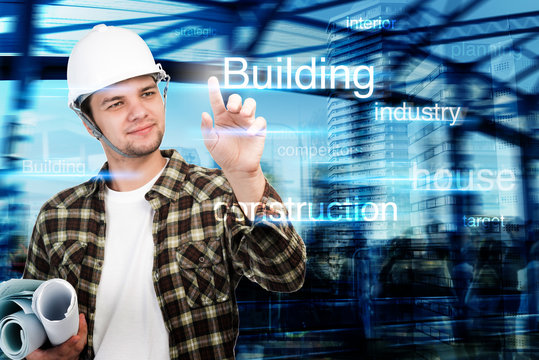 Young engineer pointing at building and construction concept