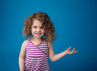 Happy Smiling Laughing Child: Girl with Curly Hair