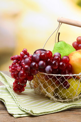Assortment of juicy fruits in wicker basket
