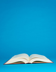 Open book on a blue background