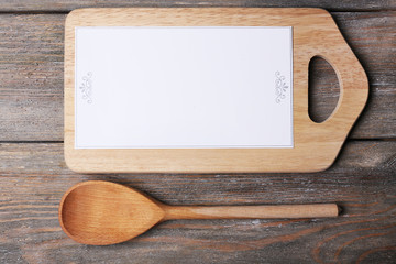 Cutting board with menu sheet of paper