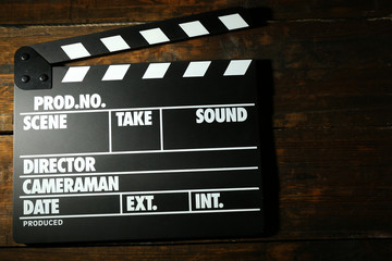 Movie clapper on wooden background