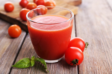 Tomato juice in glass with basil  and tomatoes cherry