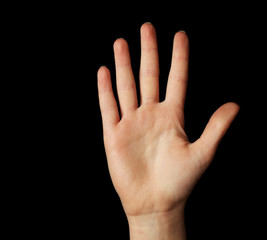 Female hand gesture on black background