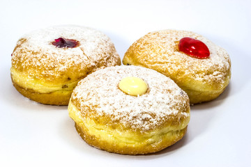 Variery of fresh donuts on white background