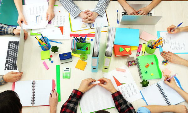 Group Of People Working At Desk Top View