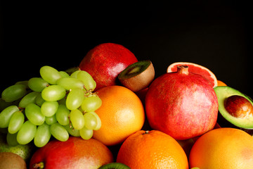 Assortment of fruits on black background