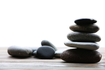 Spa stones on table on light background