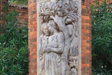 Statues on the brick column in the garden