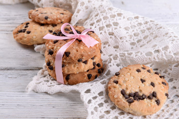 Tasty cookies on color wooden background