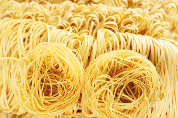 Different dry instant noodles close-up background