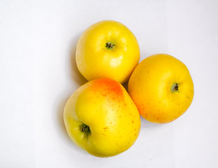 three yellow ripe apples