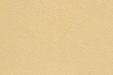 Fototapeta premium Stucco yellow wall background or texture