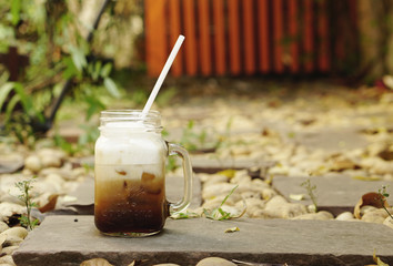 Ice coffee in jam glass bottle