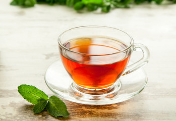 Cup of tea with mint leaves.