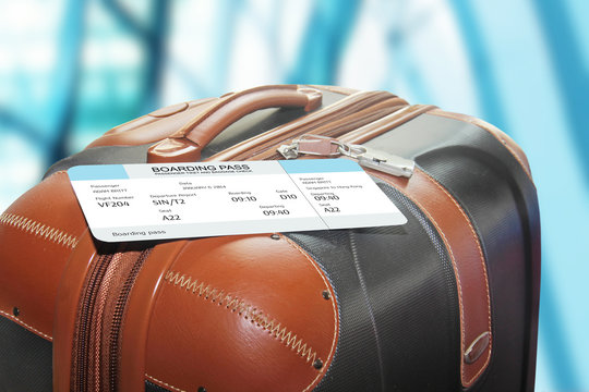 suitcase and boarding pass at the airport