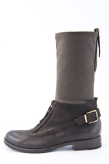 Women's brown leather boots with low heels..