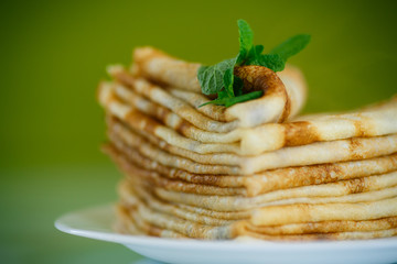 many thin pancakes on a plate
