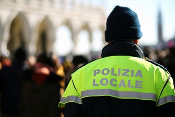 Italian policeman with police uniform patrol in venice