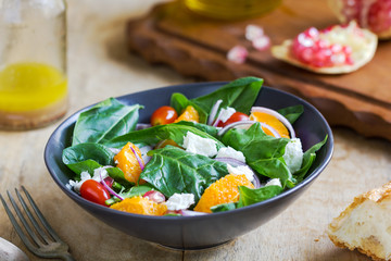 Orange with spinach, pomegranate and feta cheese salad