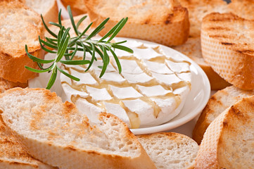 Baked Camembert cheese with rosemary and toast 