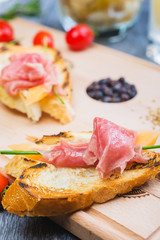 traditional Spanish tapas with slices of hamon and melon on a