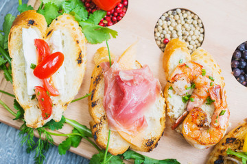 mix of traditional Spanish tapas on a wooden plate with decor