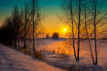 Sunset over snowy field
