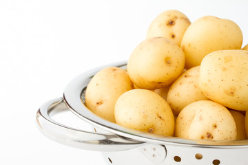 New potatoes in a stainless steel colander