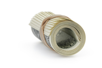 rolled hundred dollar banknotes tied with rubberband