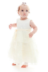 Cute little girl in a white dress